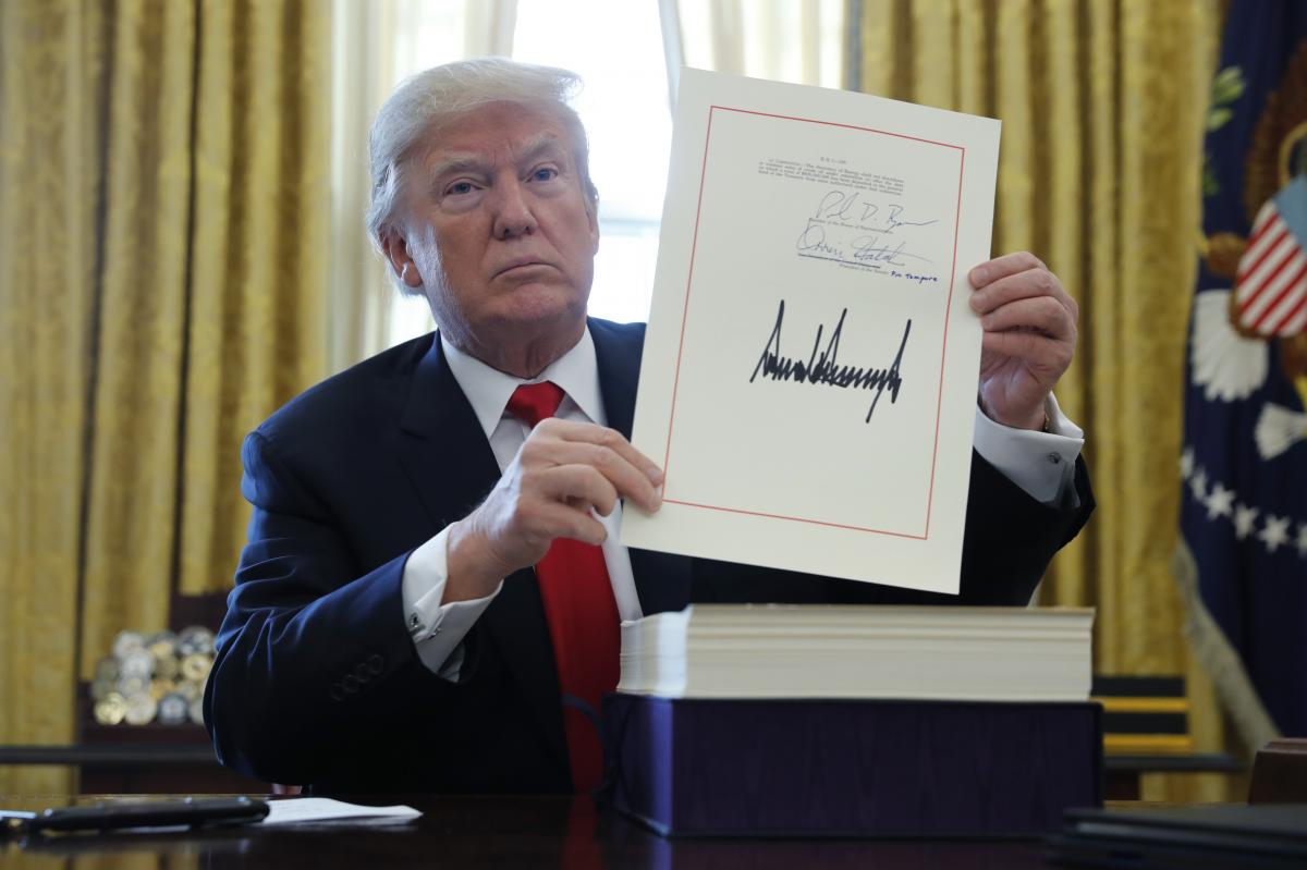 Trump Signs Tax Government Spending Bills Into Law The
