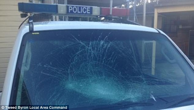 Naked Canadian attacks Australian police vehicle