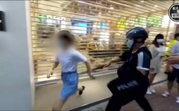 Hong Kong: Girl gets tackled by police during protest (Video) Hong Kong: Girl gets tackled by police during protest (Photo)
