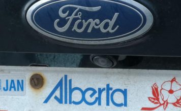 Alberta to end use of licence plate stickers, Report Alberta to end use of licence plate stickers, Report