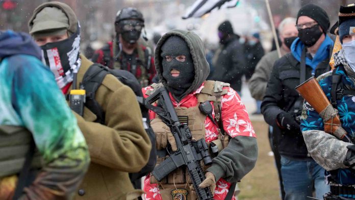 Armed protesters begin to gather at Michigan state capitol, Report Armed protesters begin to gather at Michigan state capitol, Report