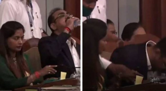 Official mistakenly sips disinfectant during presentation (Video)