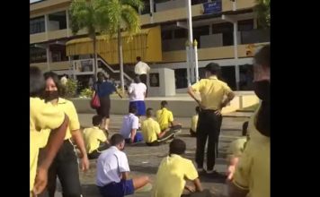 Students flee as headmaster pulls out gun during school assembly (Video) Students flee as headmaster pulls out gun during school assembly (Video)