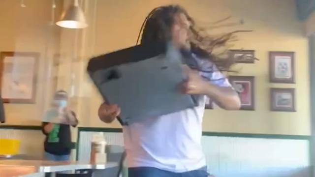 Angry customer throws cash register through window